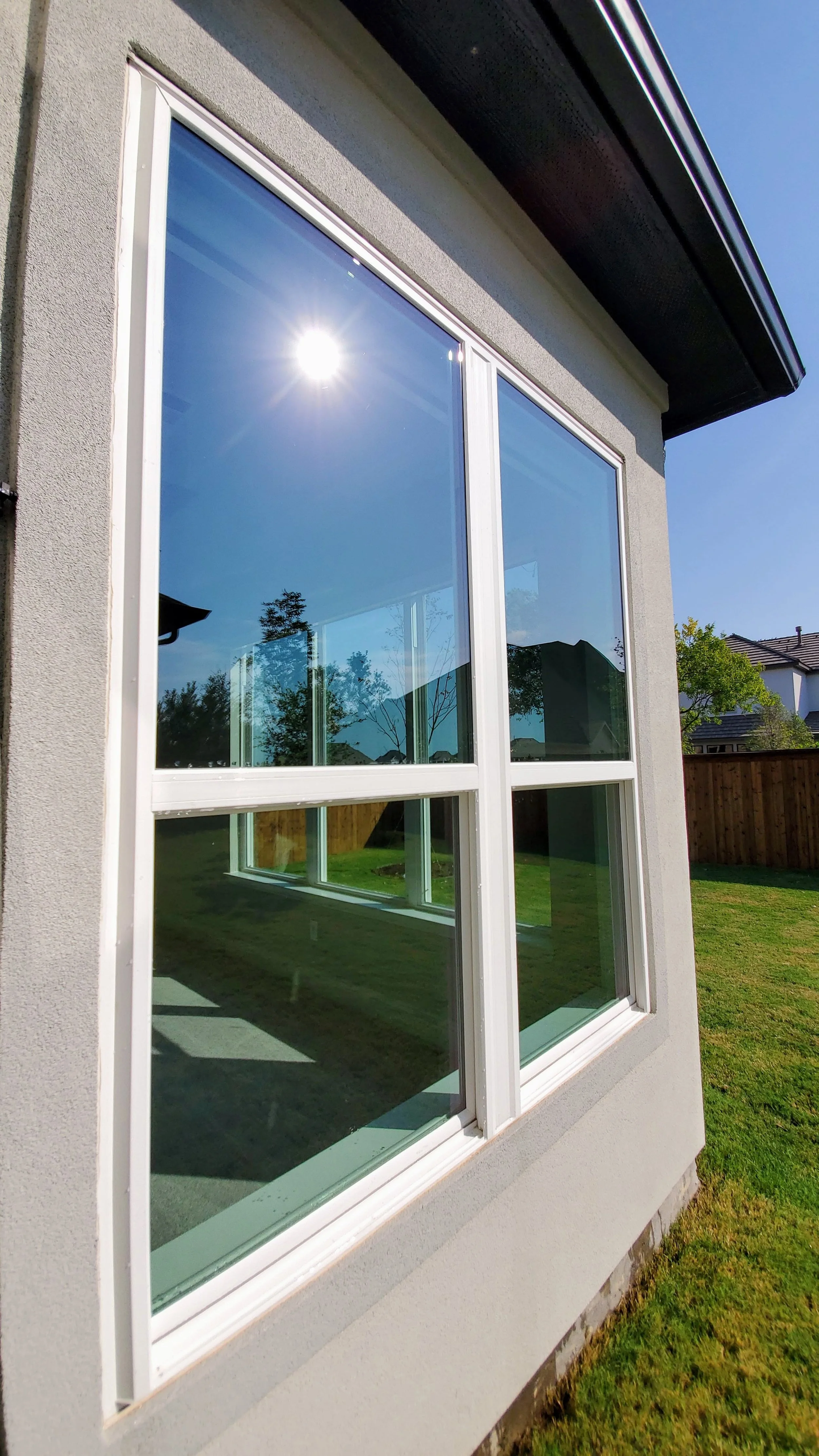 A freshly cleaned Window Worx window gleaming in the sunlight